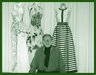 Curator Charles Kleibacker with garments from the exhibition