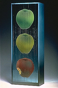 Mary Kay Simoni 
American, born 1955; lives Chesterland 
The Apple of Eve's Eye , 1998 
Stacked, laminated and painted glass 
15 x 5 x 3 
Courtesy of the artist 