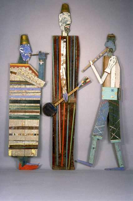 Tamara JaegerMusiciansca.1994Assemblage of found wood, painted wood and metal, clay, and glitter119" x 88" x 4"