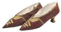 Image of red and ivory leather slip-on shoes circa 1790.