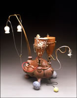 Image of ceramic and mixed-media sculpture work by Robert "Boomer" Moore titled Pump'R & Feed 'R