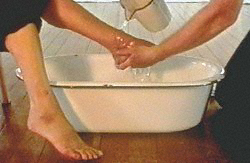 Malcolm Cochran 
Washing Feet (details) 
1996-97 
video projection, marble courtesy the artist 